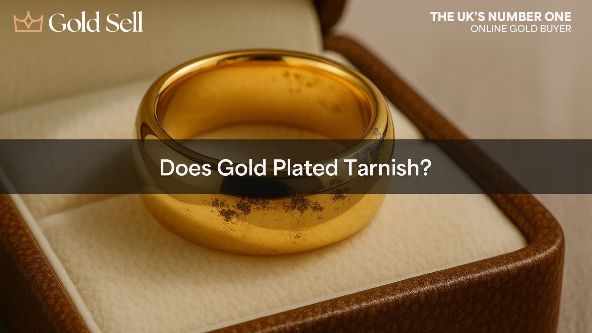 Close-up of a gold plated ring with visible tarnish spots, placed in a jewellery box, with the overlaid question “Does Gold Plated Tarnish?”—highlighting the common issue of tarnish on gold over time.