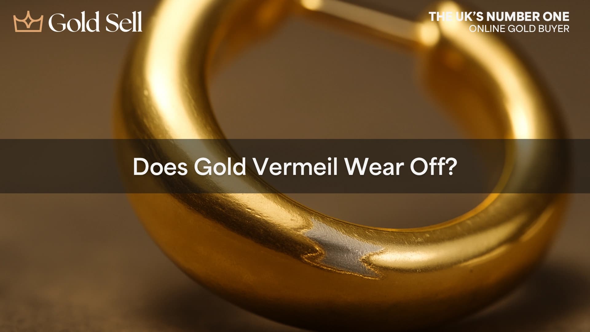 Close-up image showing worn gold vermeil earring with exposed silver base, visually answering the question: does gold vermeil wear off?