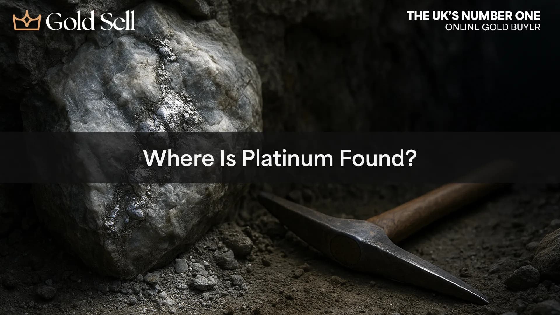 Close-up of platinum embedded in quartz rock with a pickaxe beside it in a mine, representing the question where is platinum found.