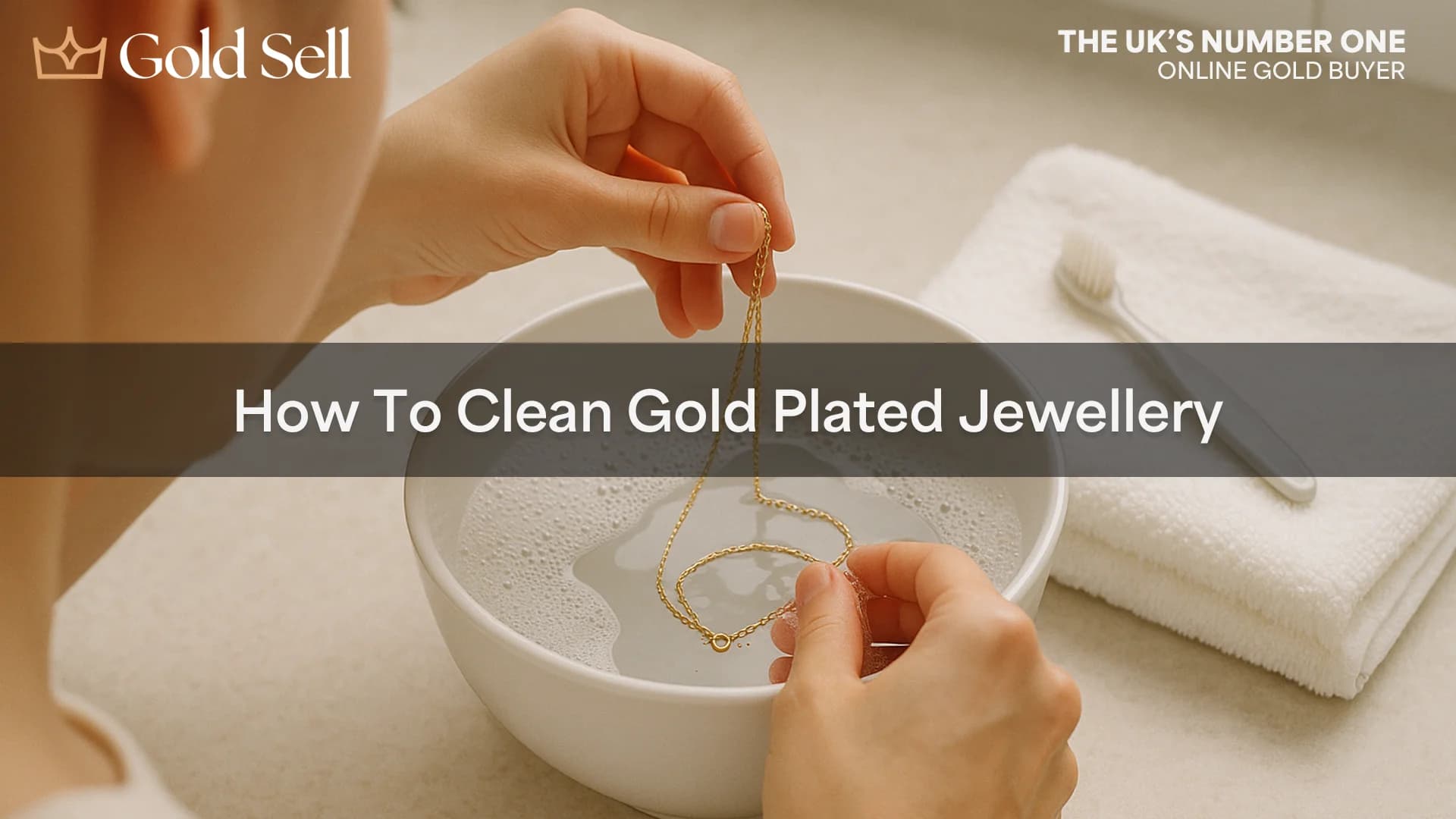 A person demonstrating how to clean gold plated jewellery by soaking a necklace in soapy water to gently remove tarnish on gold plated jewellery.