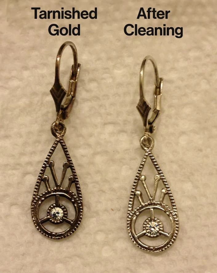 Close-up of earrings showing tarnish on gold before and after cleaning, demonstrating how to untarnish gold jewellery at home.
